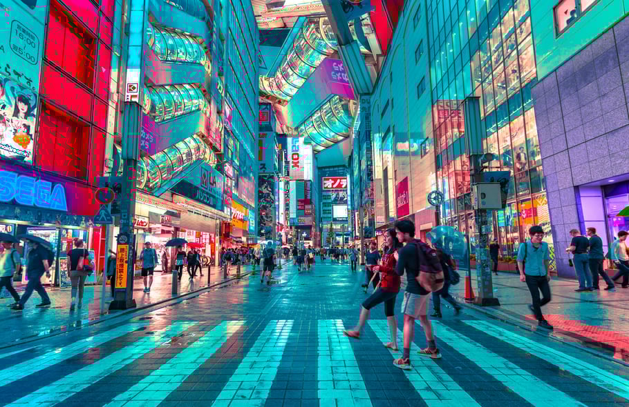 People walking in Tokyo near well lit buildings. Photo by Jezael Melgoza on Unsplash