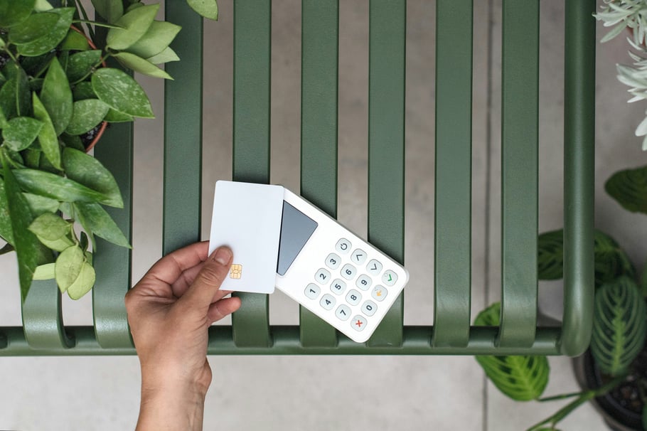 Credit card and POS machine. Photo by Mockuuups on Unsplash